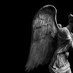 Bibi Campbell - Black and white image of a winged statue, dimly lit.