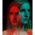 Ella Martin - Double exposure portrait of a young woman in blue and red light against a black backdrop.