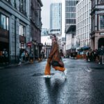 Isaac Crew - Portrait of a women walking across the road in a city scene